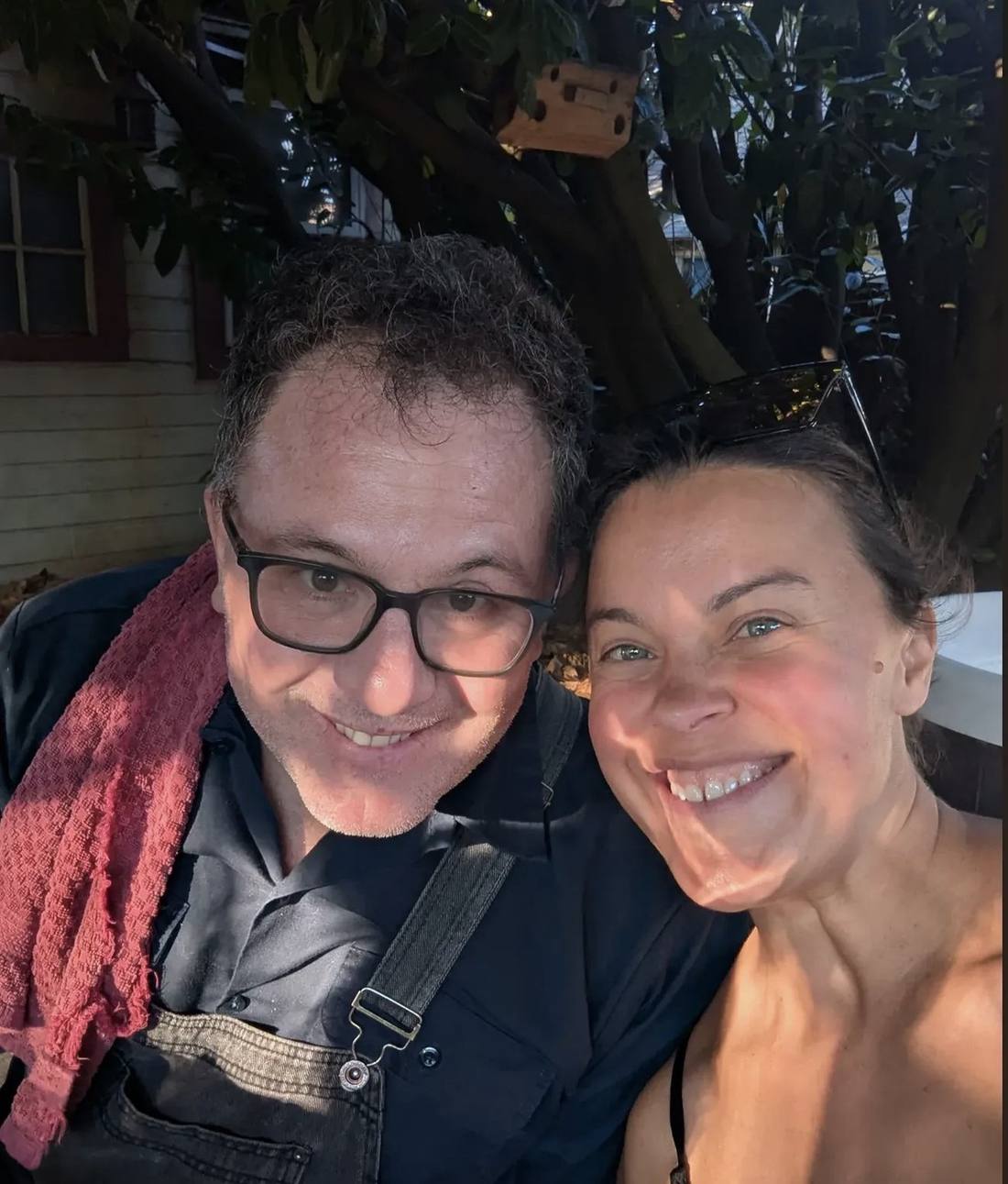 Two of the crew outside by the sauna at the end of a day