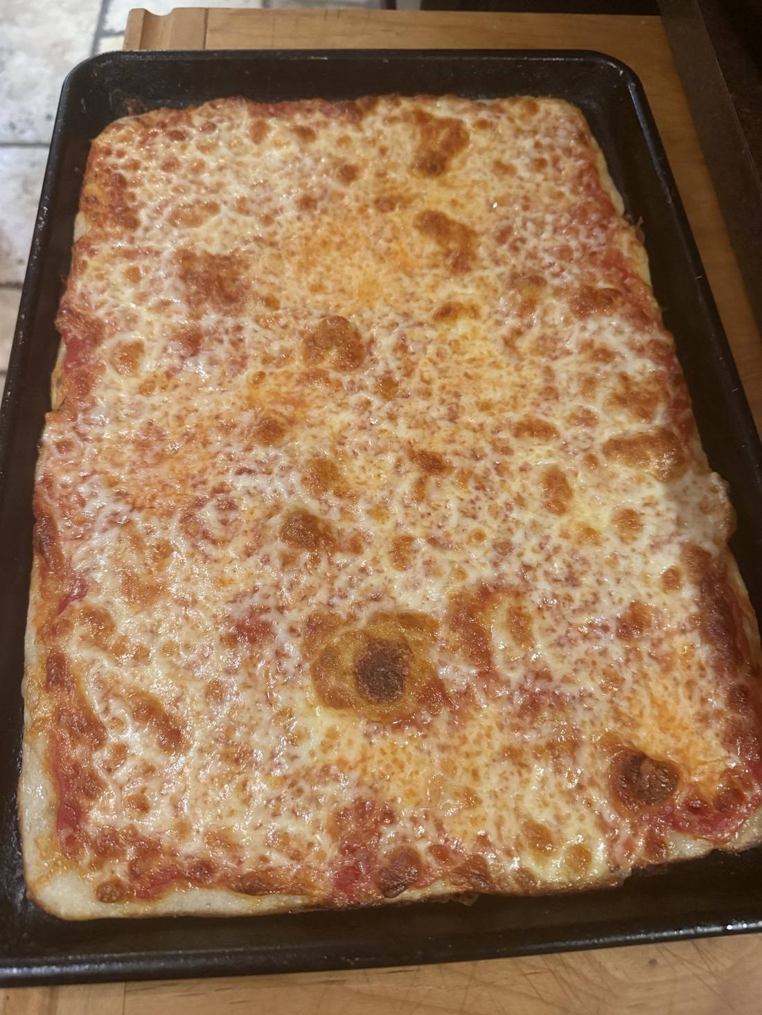 A Sicilian sheet pizza fresh out of the oven